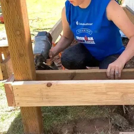 woman adding joists for a DIY Simple front porch