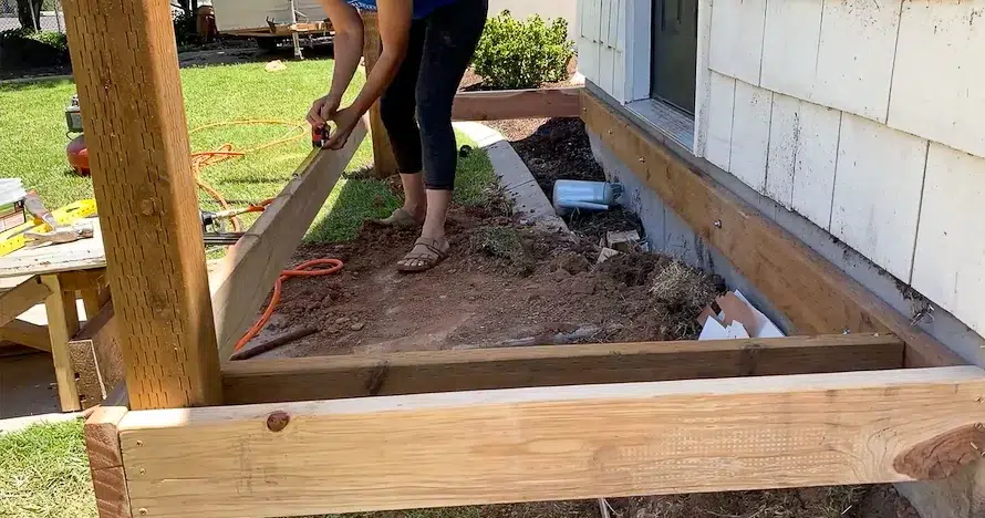 woman measuring for joists