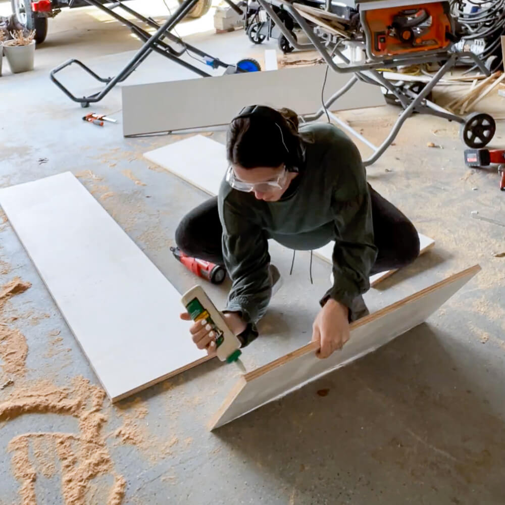 woman constructing built ins