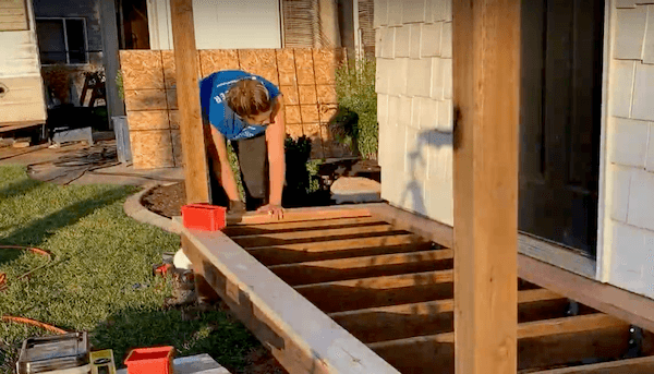 woman installing a front porch