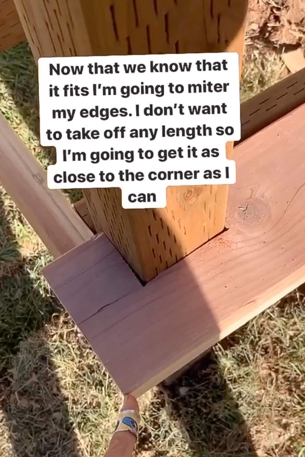 Notched trim board fit tightly around a porch post before mitering the corner.