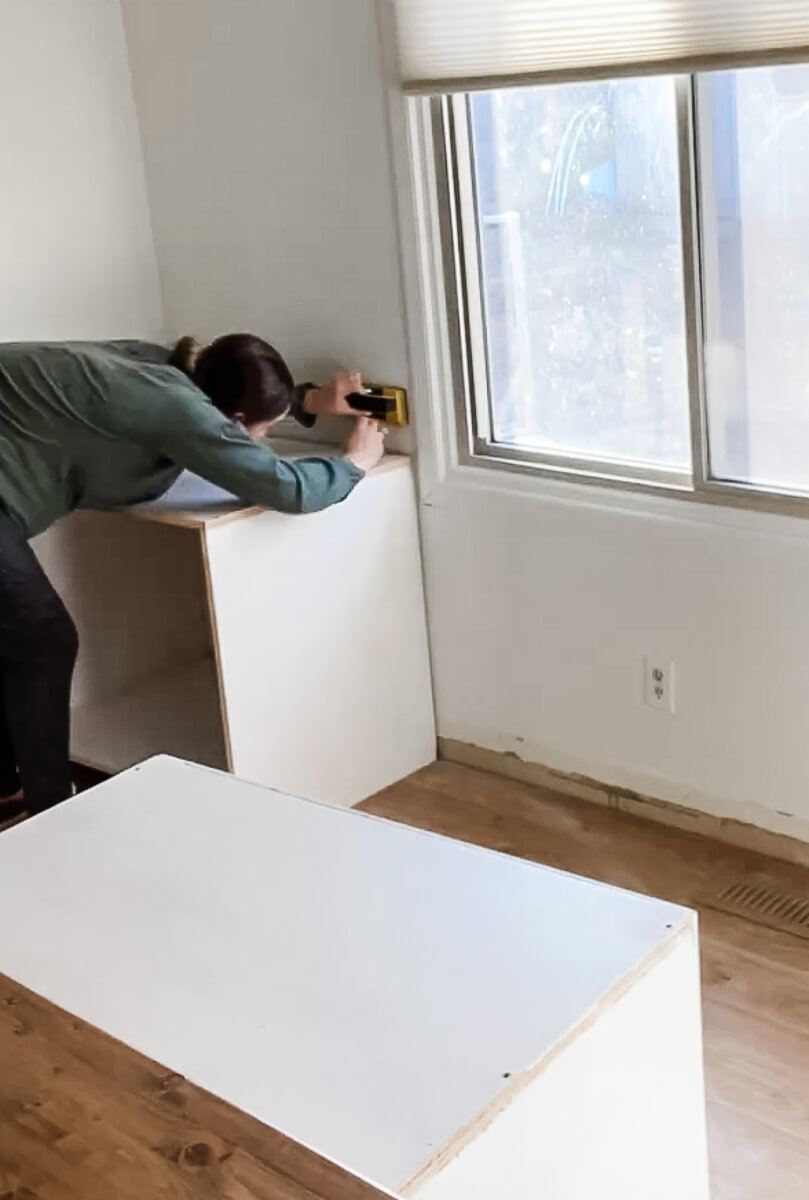woman using a stud finder