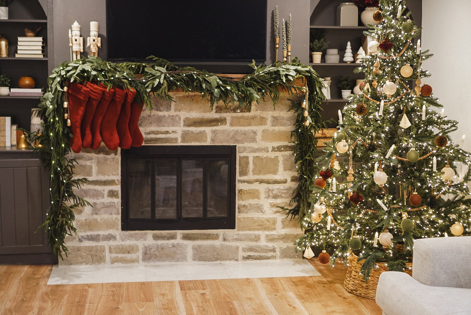 traditional Christmas decor on decorated mantel and tree