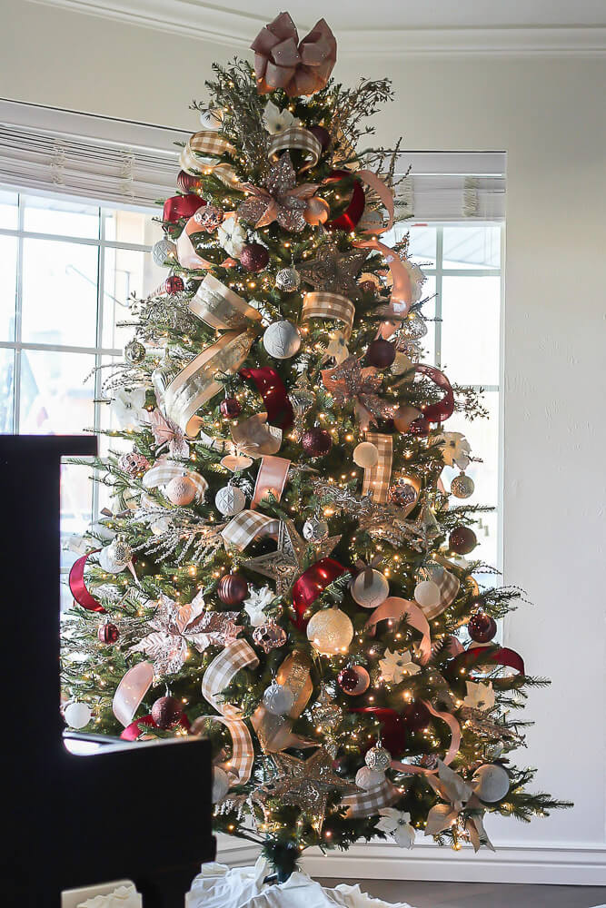 extravagant christmas tree with ribbons and bows