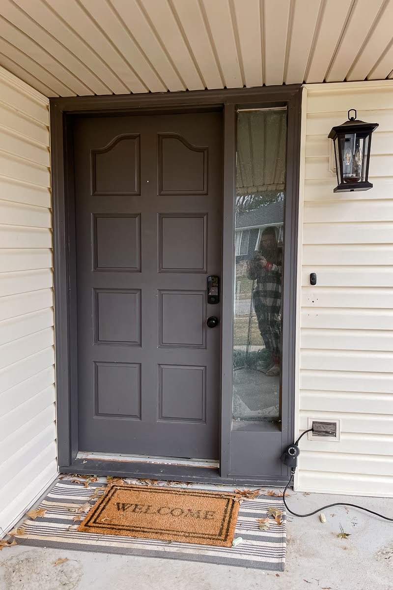 Front porch ready with gray door and rug