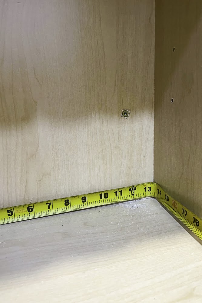 Measuring inside kitchen cabinet for spice rack
