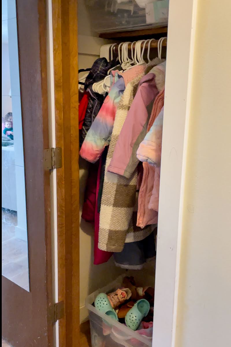 Inside messy coat closet that needs organization and a makeover