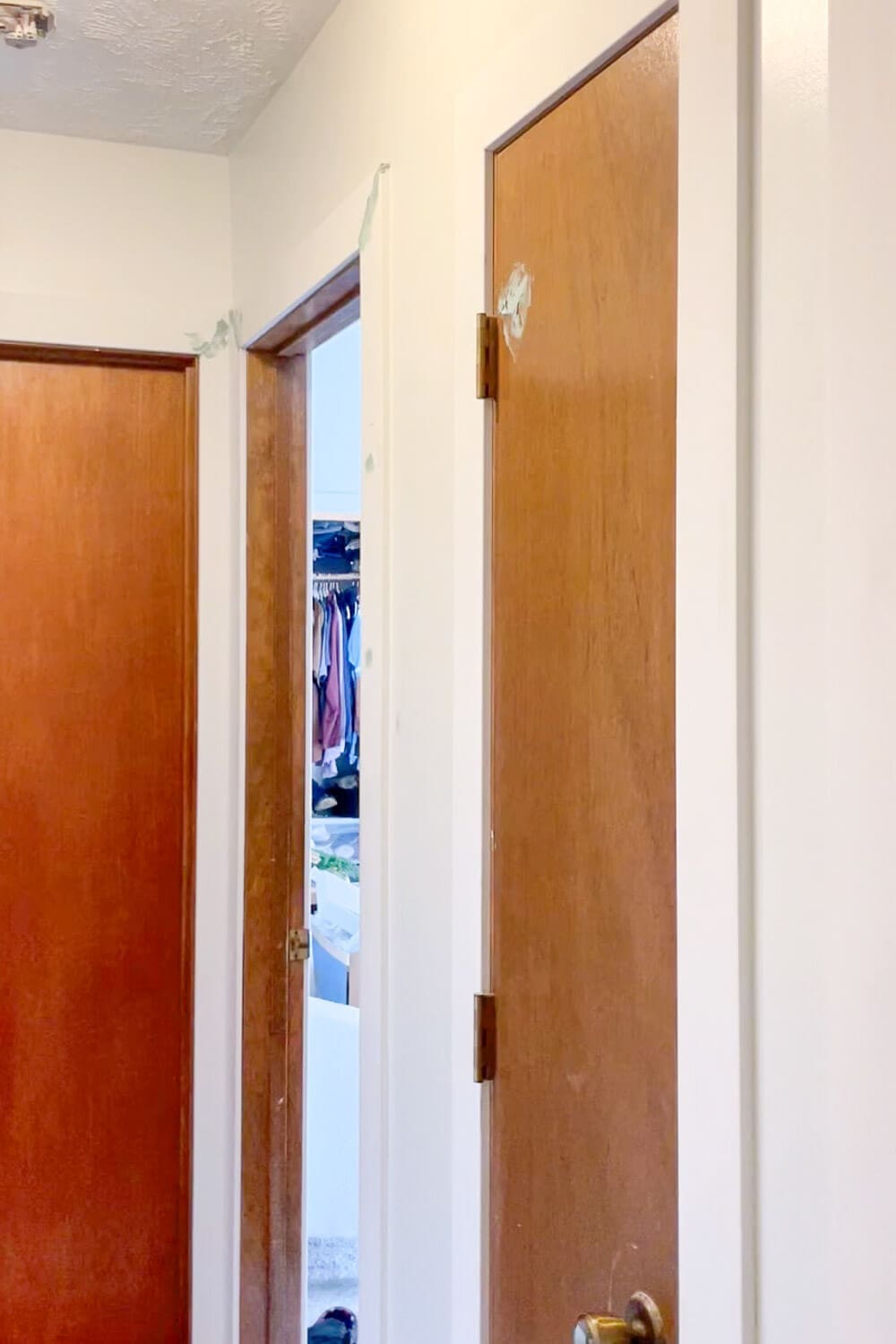 Old hollow core hallway doors before DIY upgrade