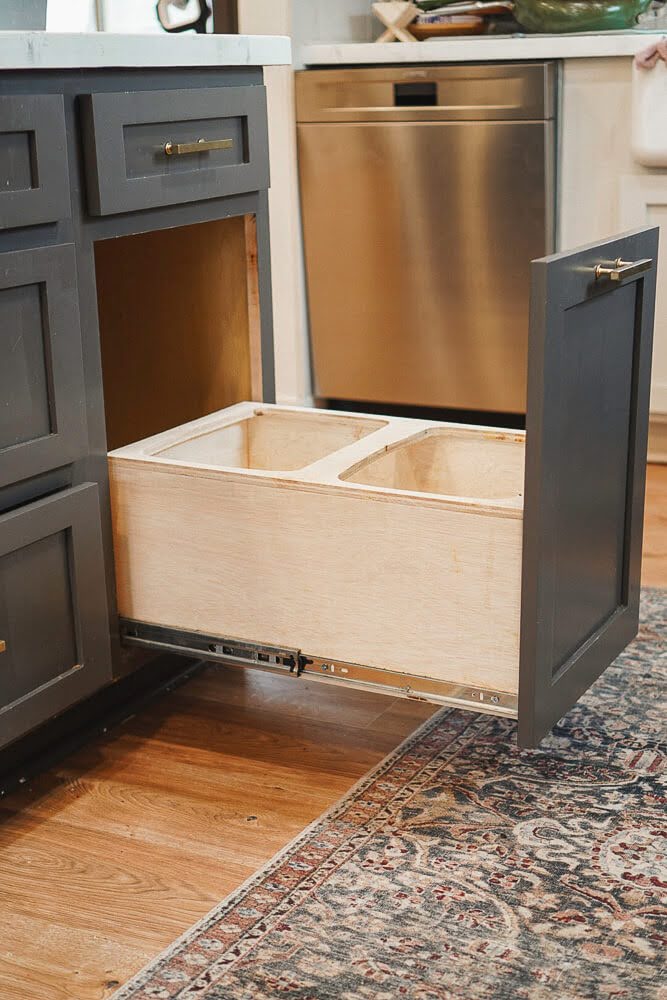 Functioning pull-out trash can drawer in kitchen