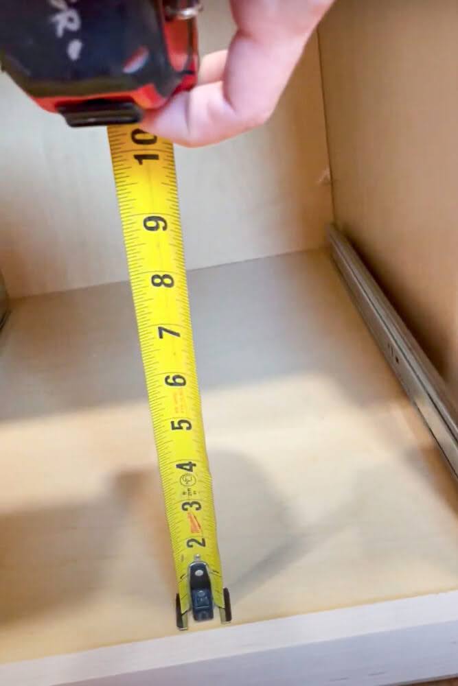 measuring height of trash drawer in cabinet