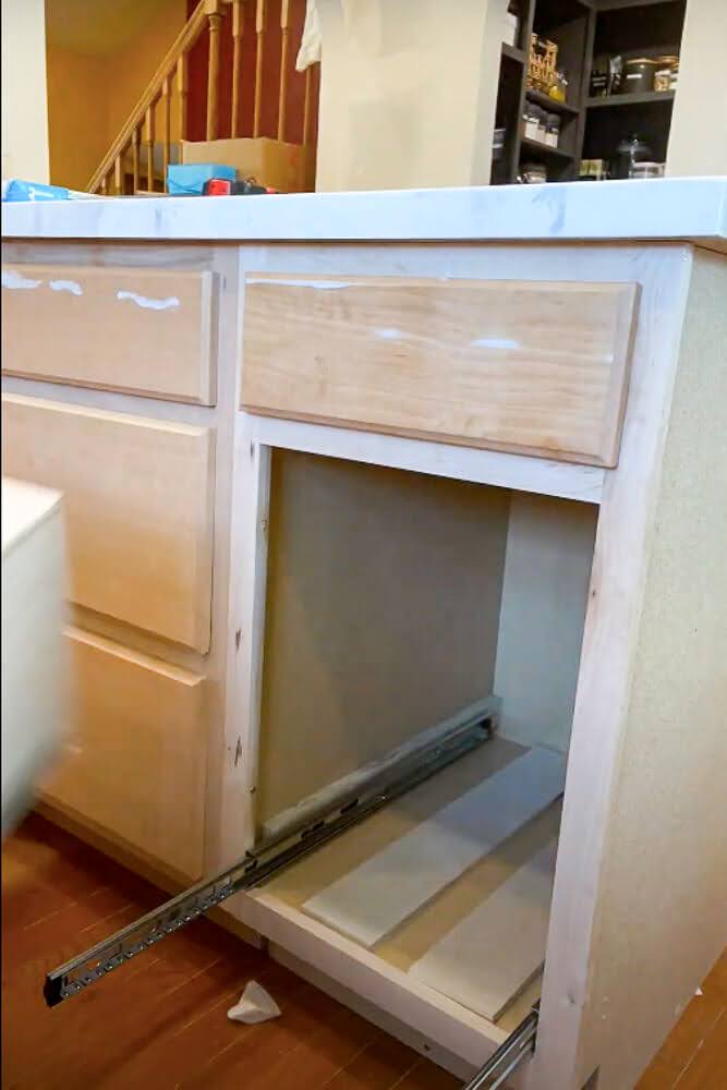 mounted drawer slide completely extended outside of cabinet
