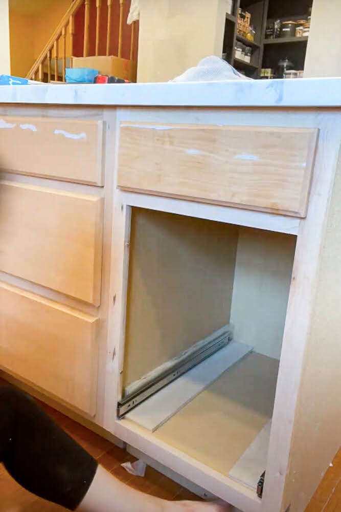 spacers put into cabinet for drawer slides to sit on while being installed