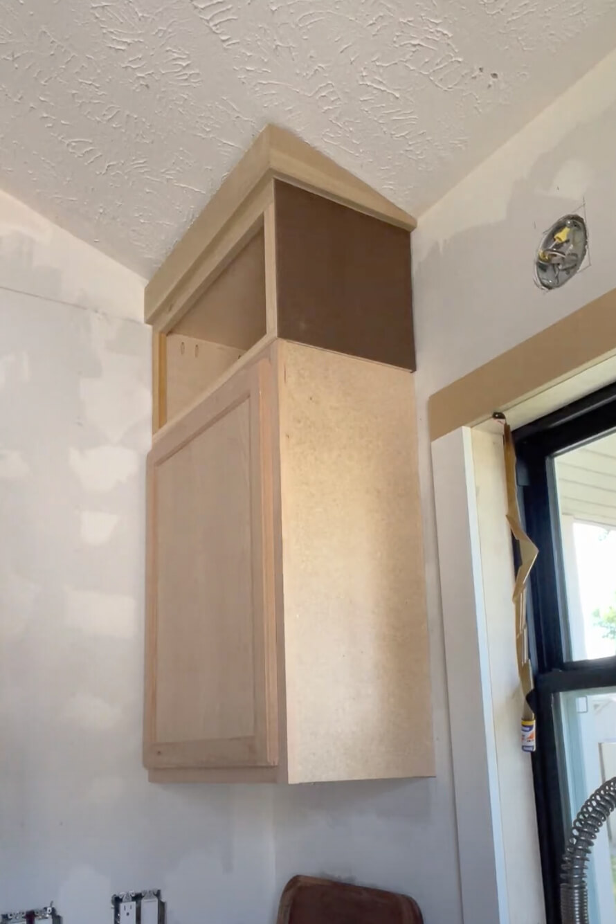 Extending kitchen cabinets to the ceiling.