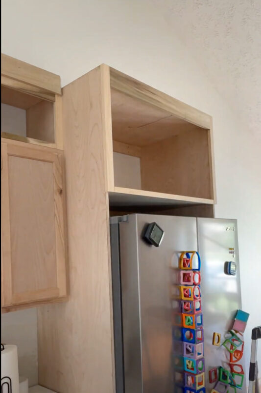 Trim added to DIY Refrigerator Cabinet.