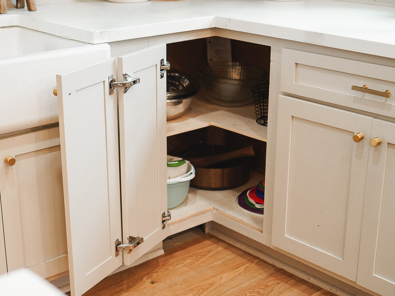 Styled kitchen cabinet after DIY removal of a Lazy Susan.