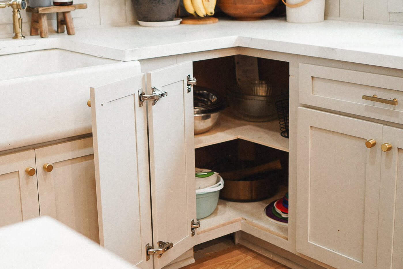 Removing a lazy susan cabinet for shelves.