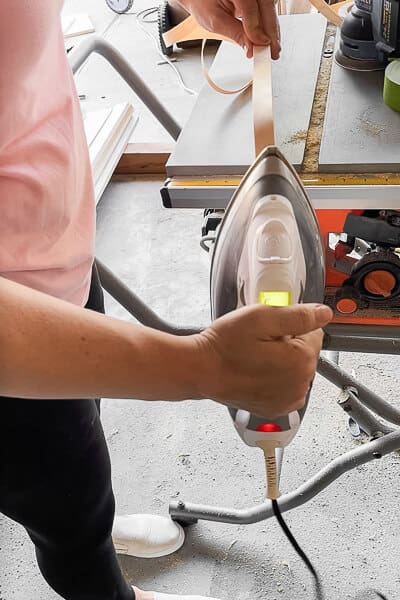 Applying edge banding with a household iron to cover plywood edge for Murphy bed project
