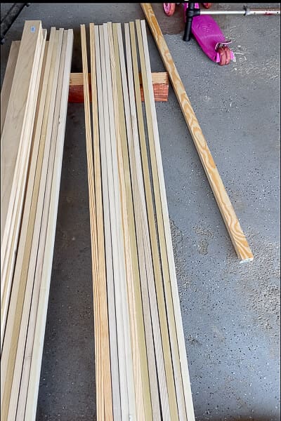 Stack of poplar wood boards laid out in garage