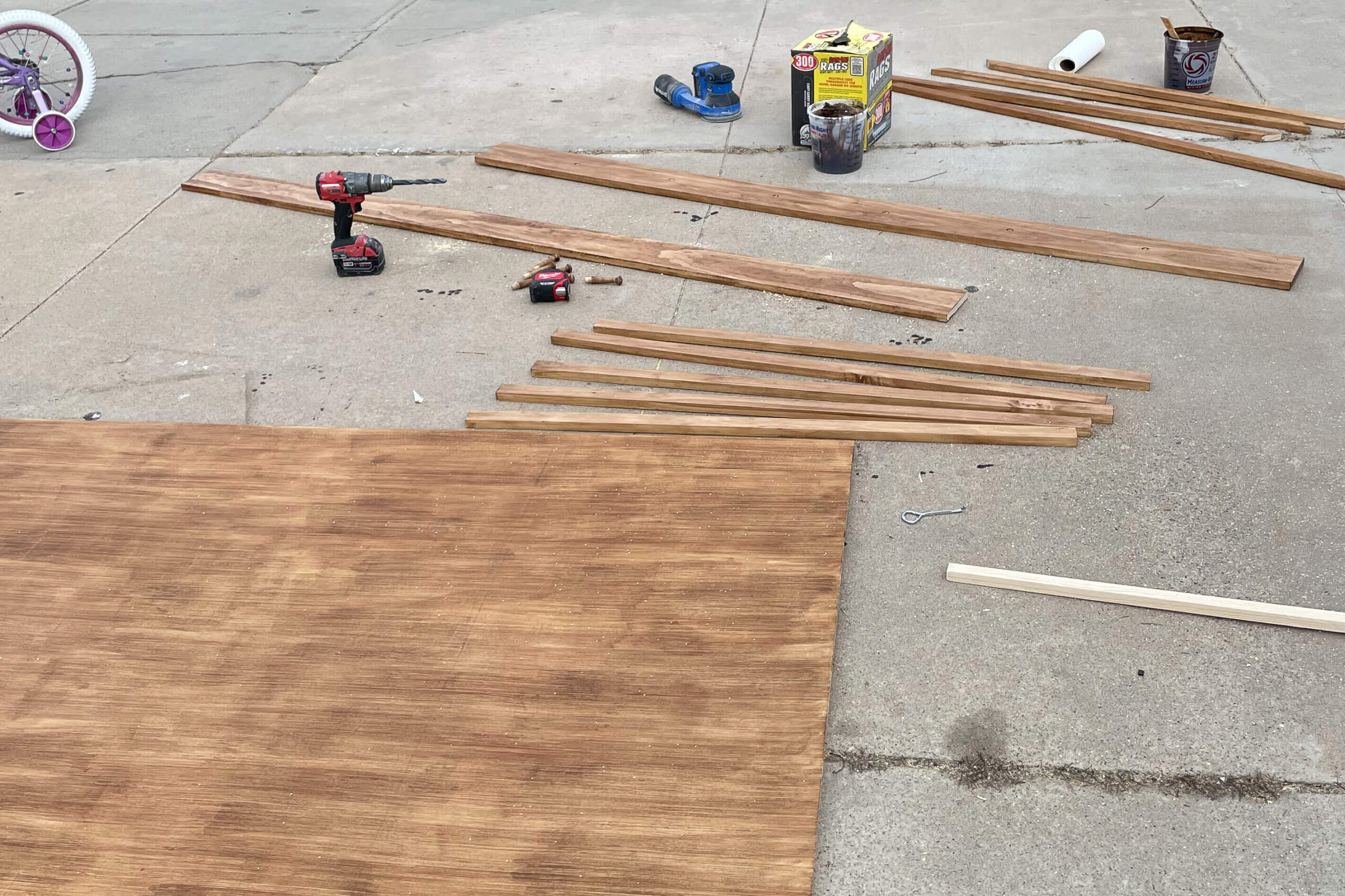 Staining all the pieces for the board and batten bathroom wall. 