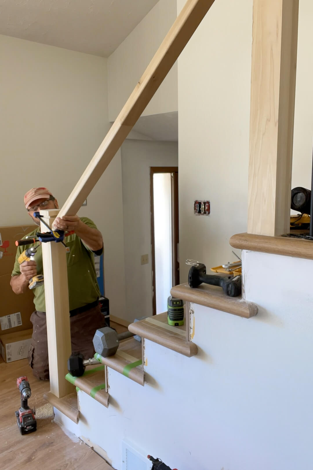 Installing a handrail on a modern style stairs.