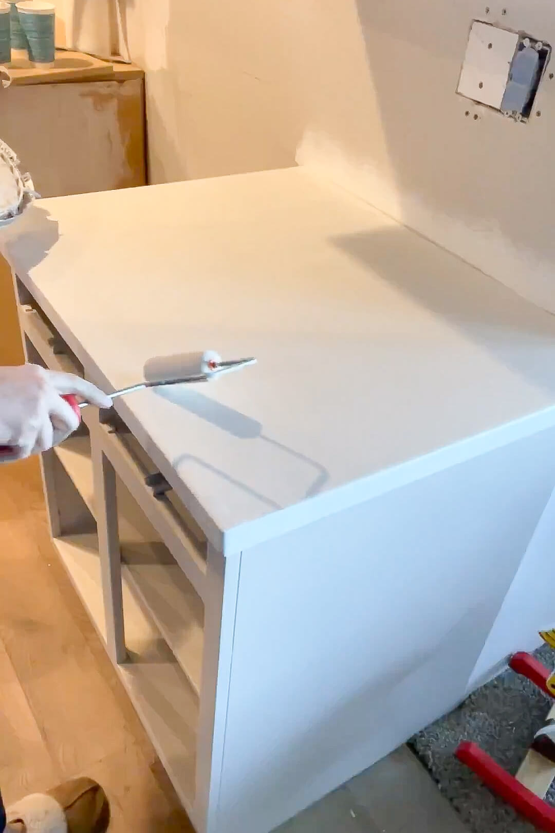 Painting a countertop for a faux marble finish. 