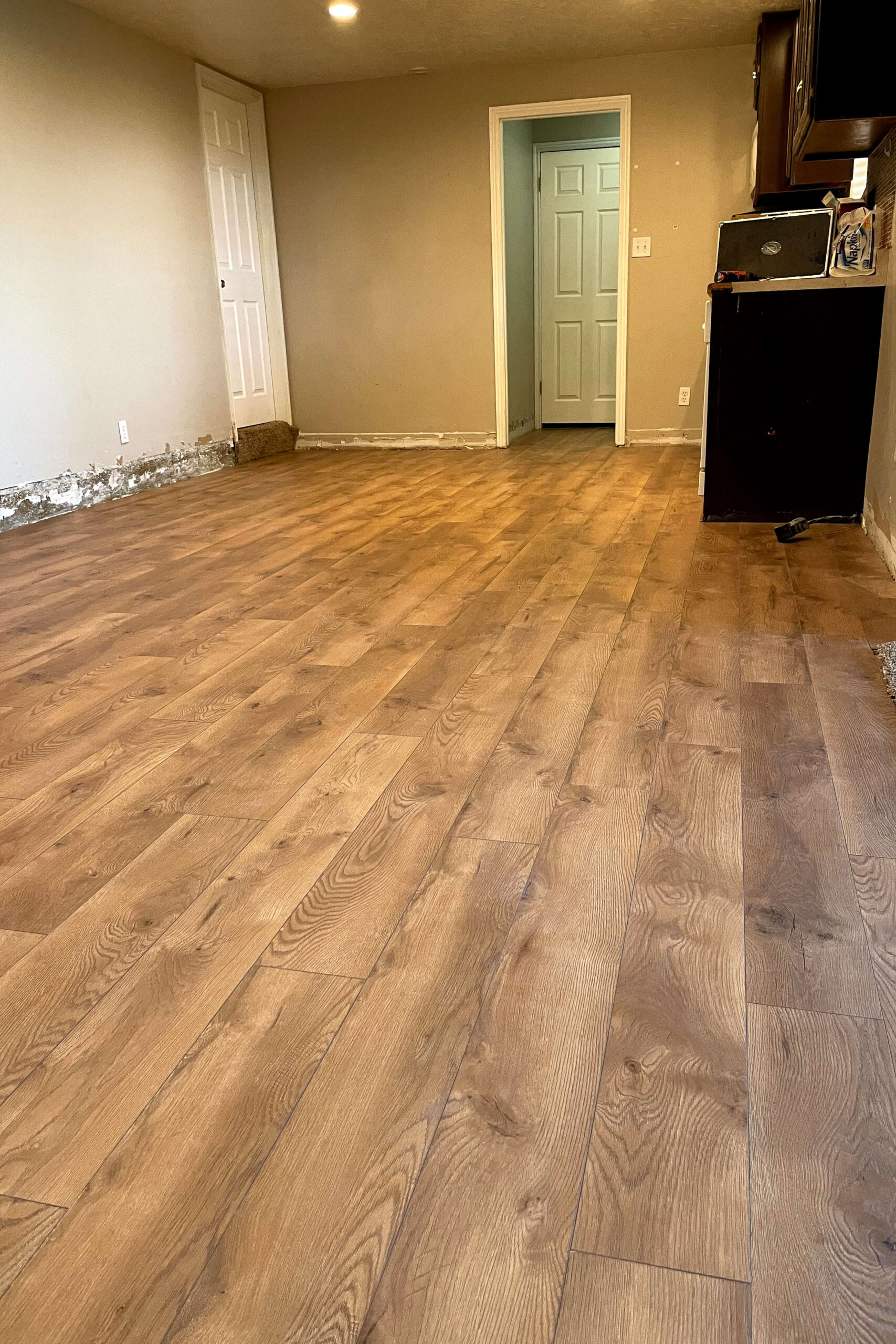 Finished laminate flooring in a kitchen remodel.