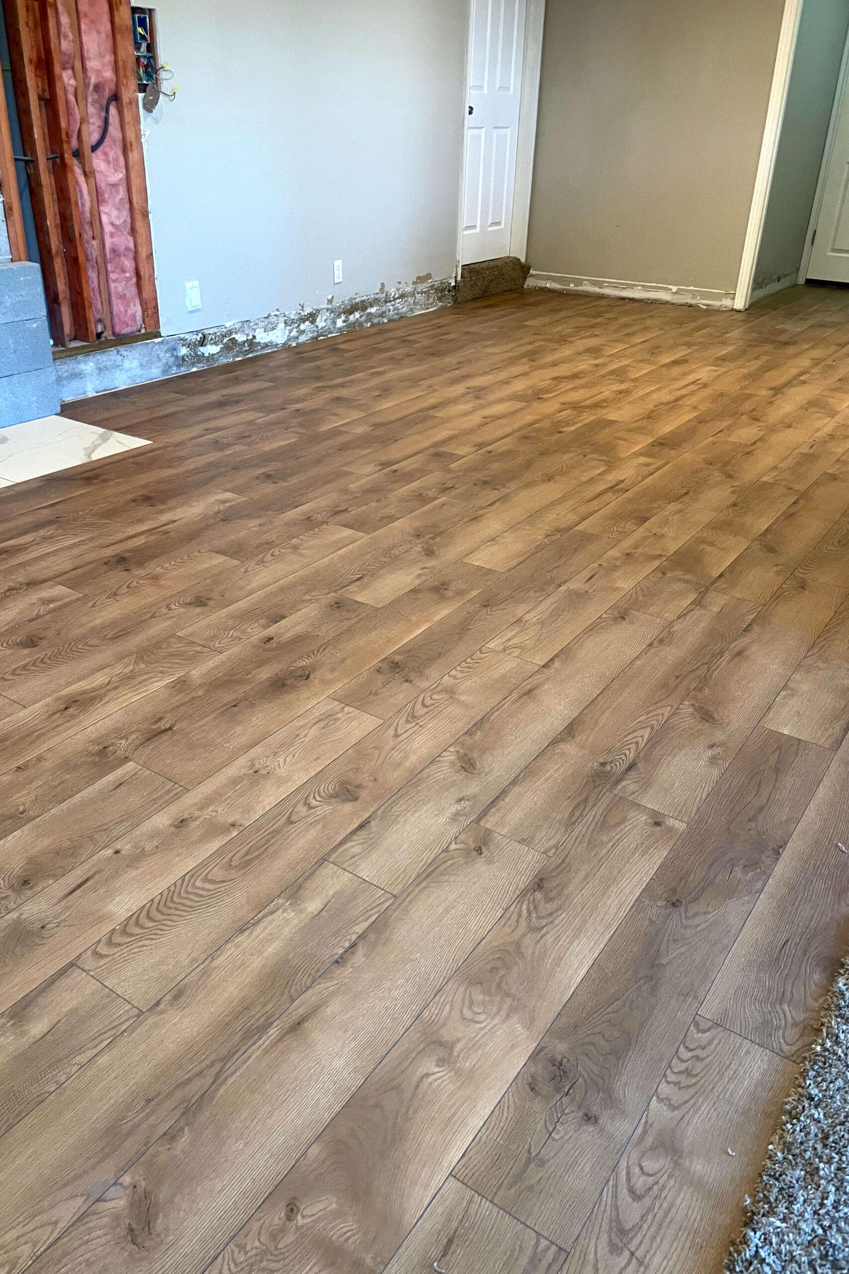 Finished laminate flooring in a kitchen remodel.