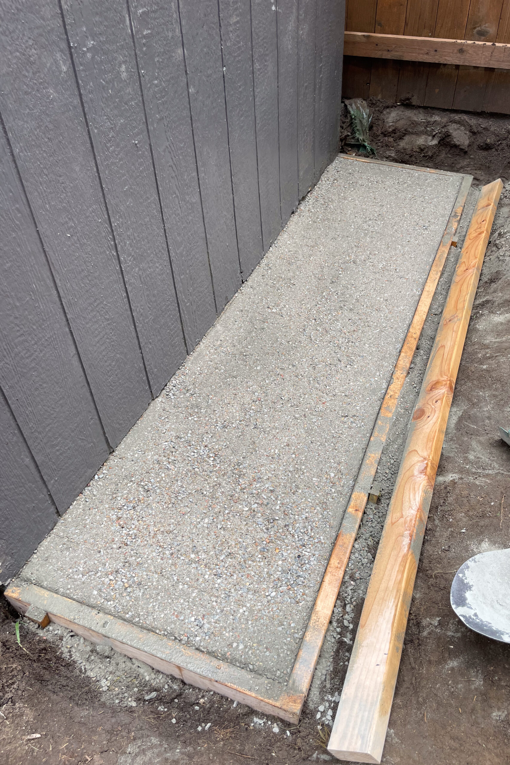 Installing a small dry pour concrete pad behind my shed. 