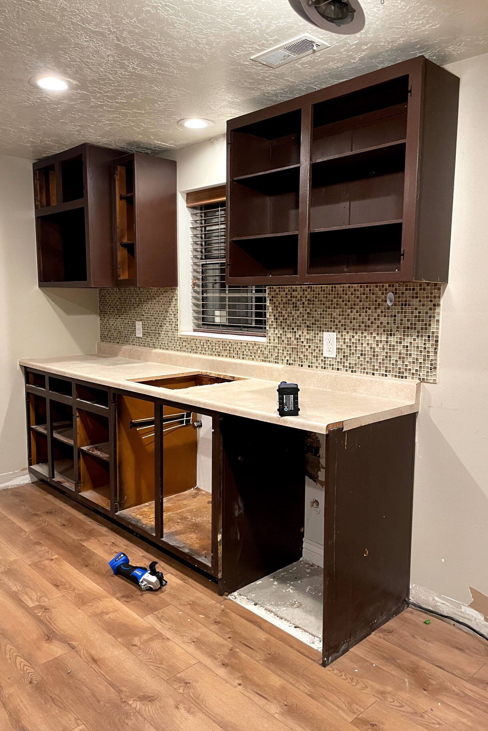 Removing cabinets during a kitchen remodel.