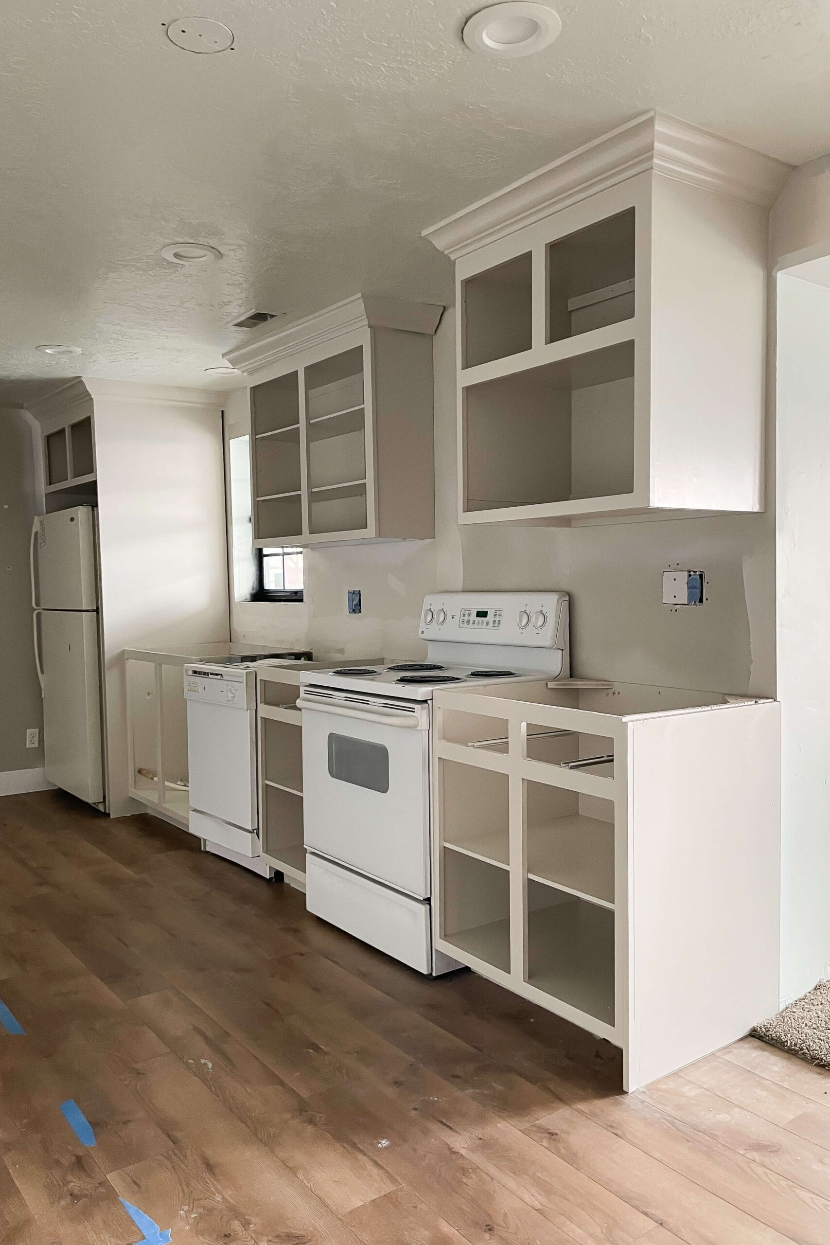 Refurbished kitchen cabinets after being painted.