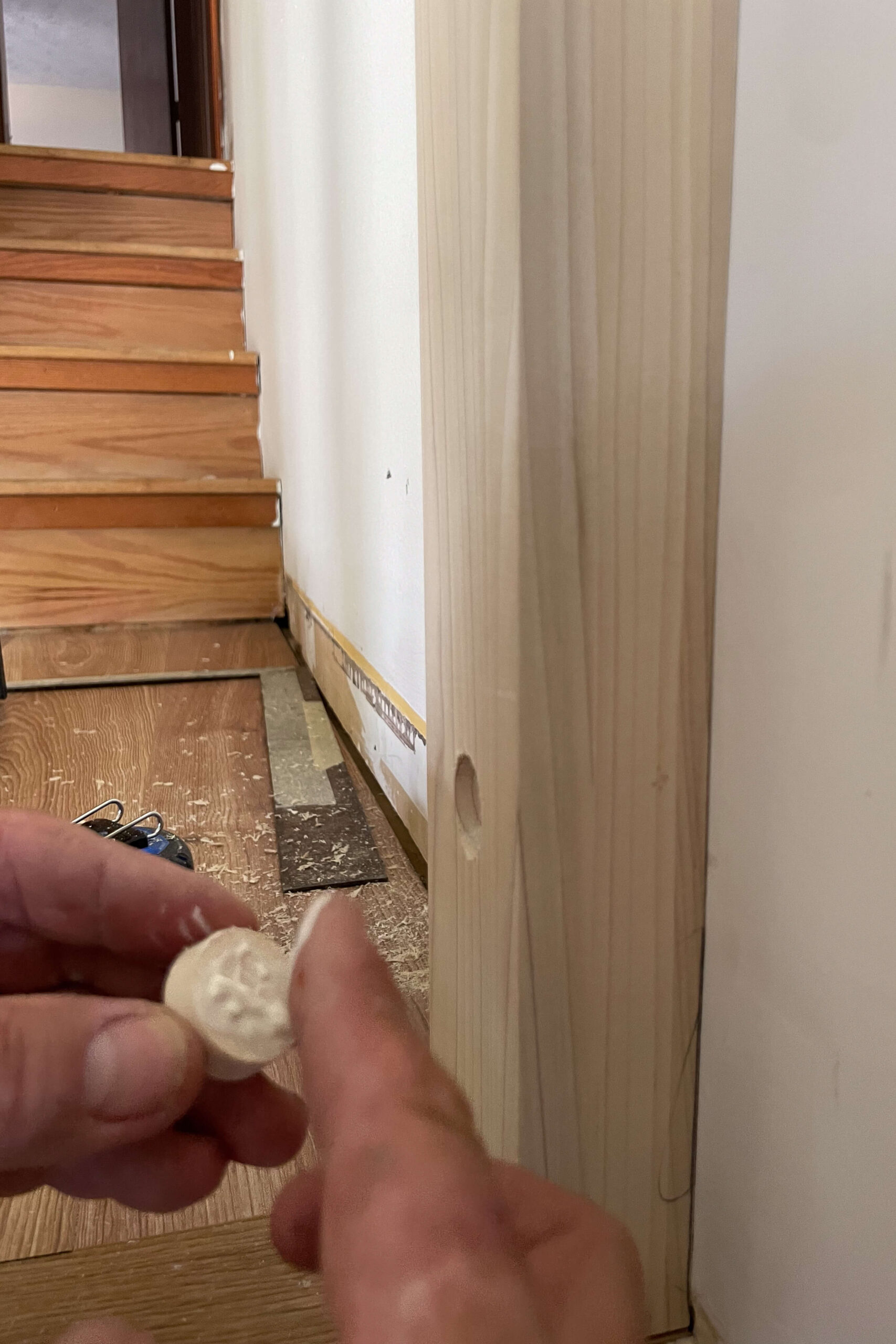 Filling in a hole from attaching a newel post to the wall with a lag bolt. 