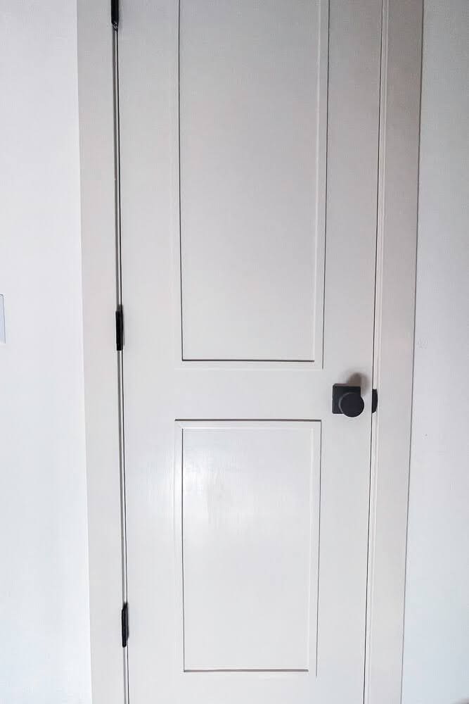 White paneled closet door upgrade after DIY home renovation.