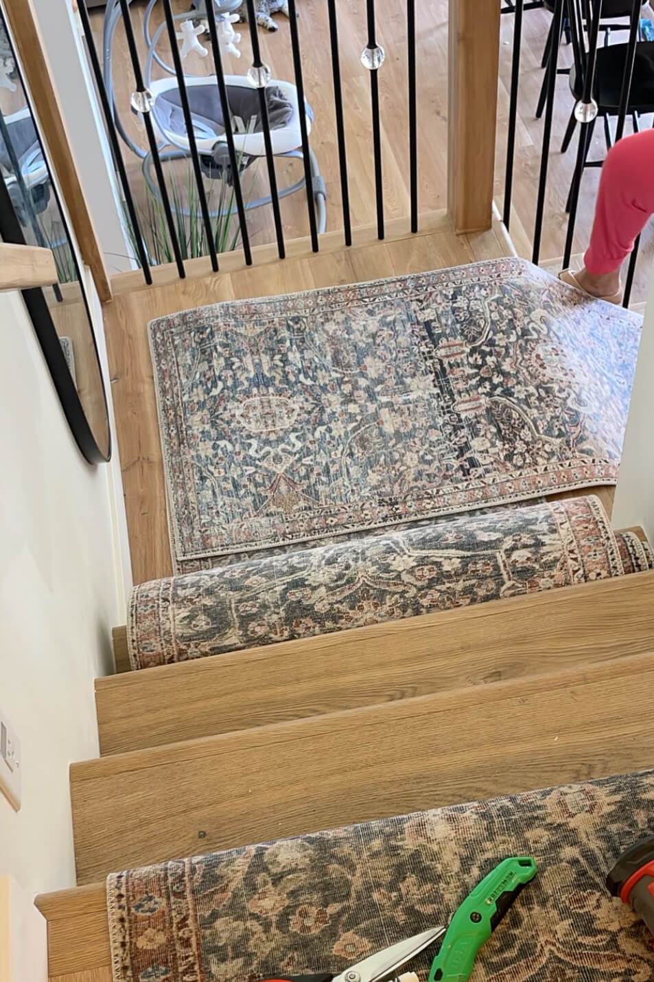 Installing a stair runner on a landing that changes direction. 