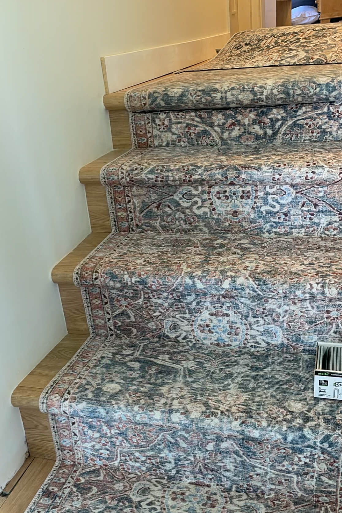 Finished carpet runner at the top of the stairs. 