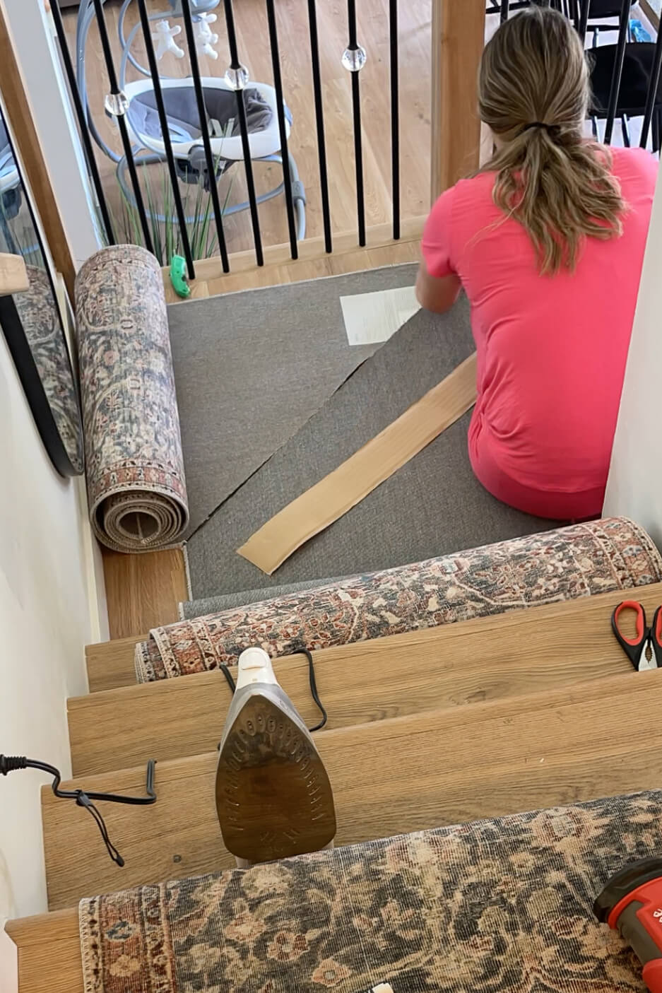 Using iron on carpet tape to attach two pieces of a carpet runner.