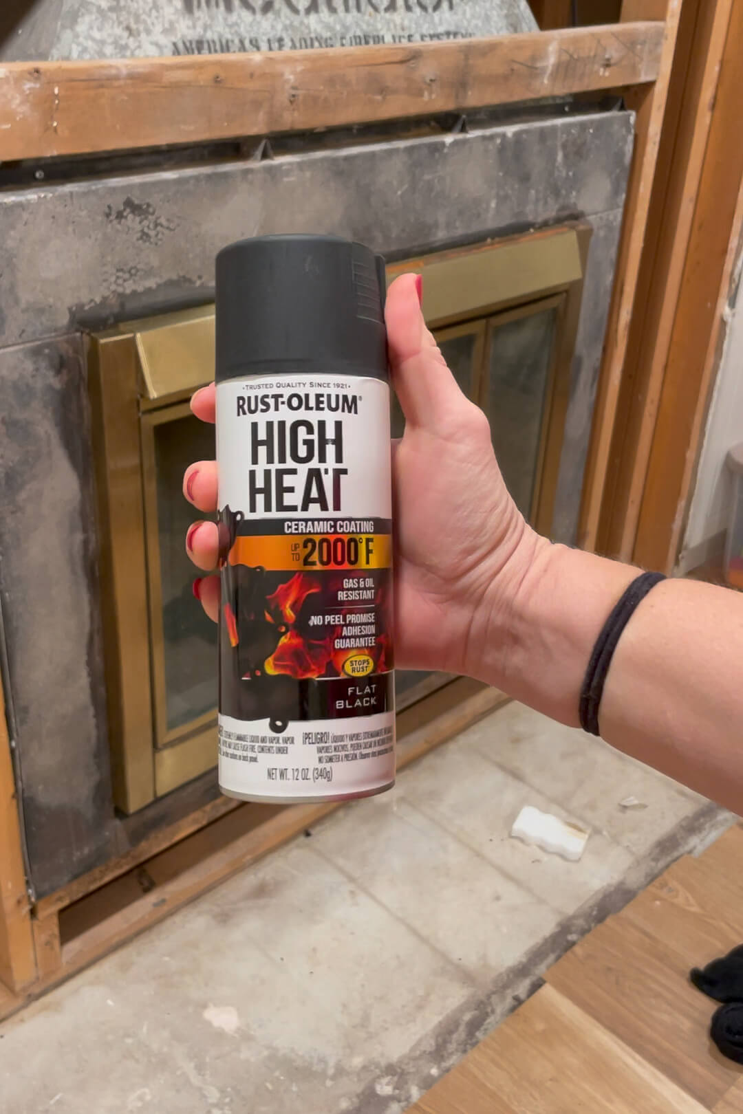 Using high heat spray paint on a fireplace insert.