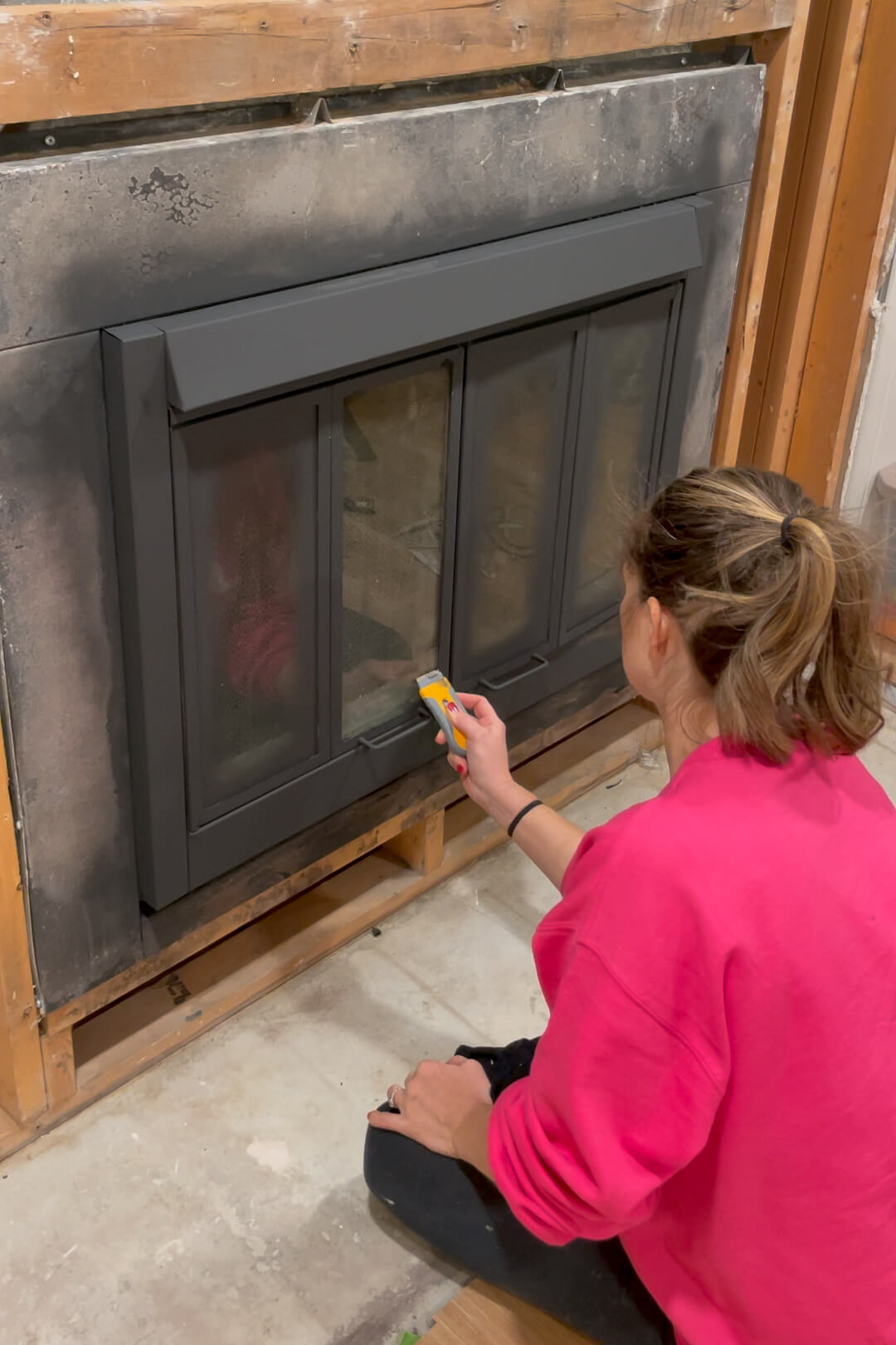 Using high heat spray paint on a fireplace insert.