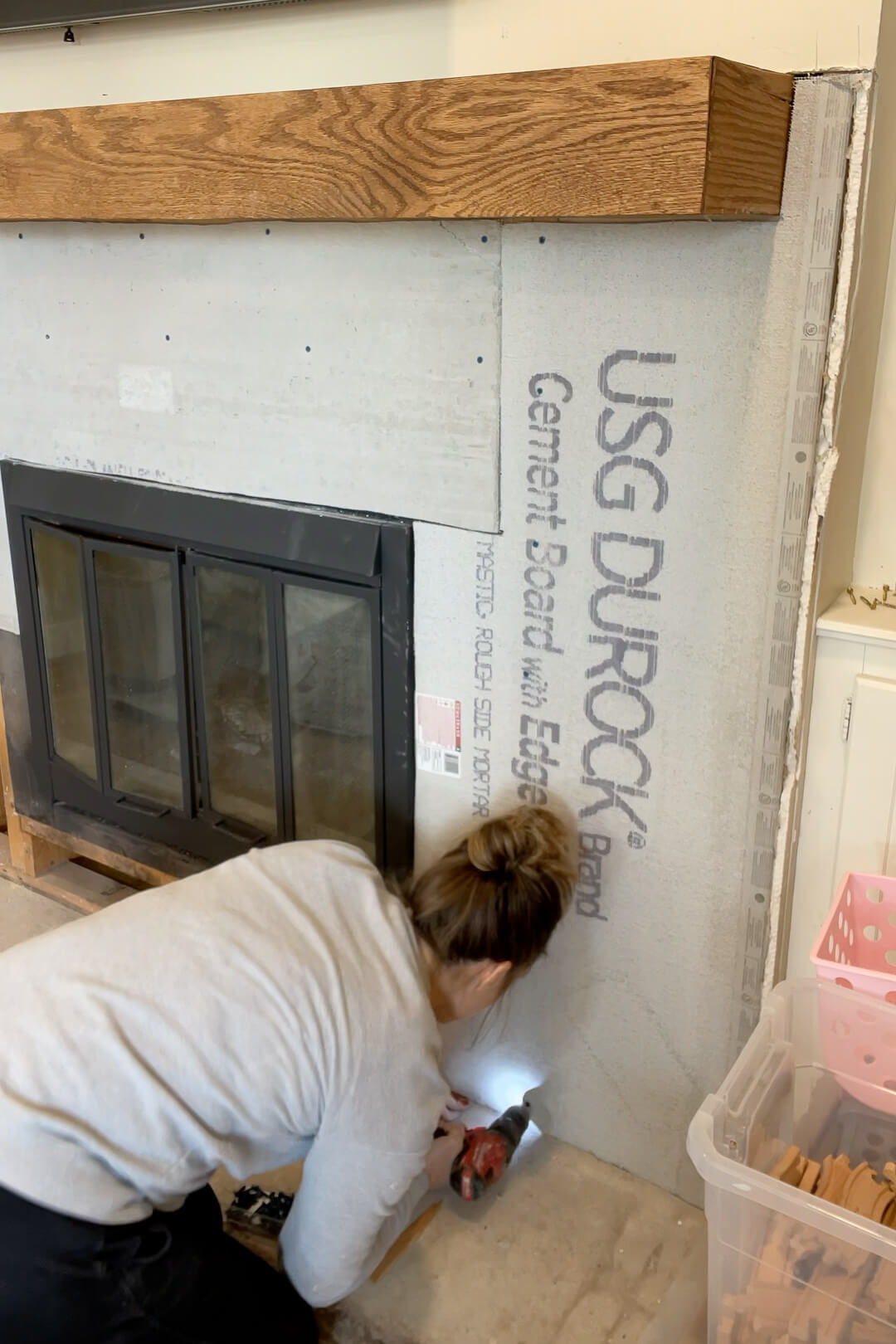 Installing cement board for a backing for my stone fireplace surround.