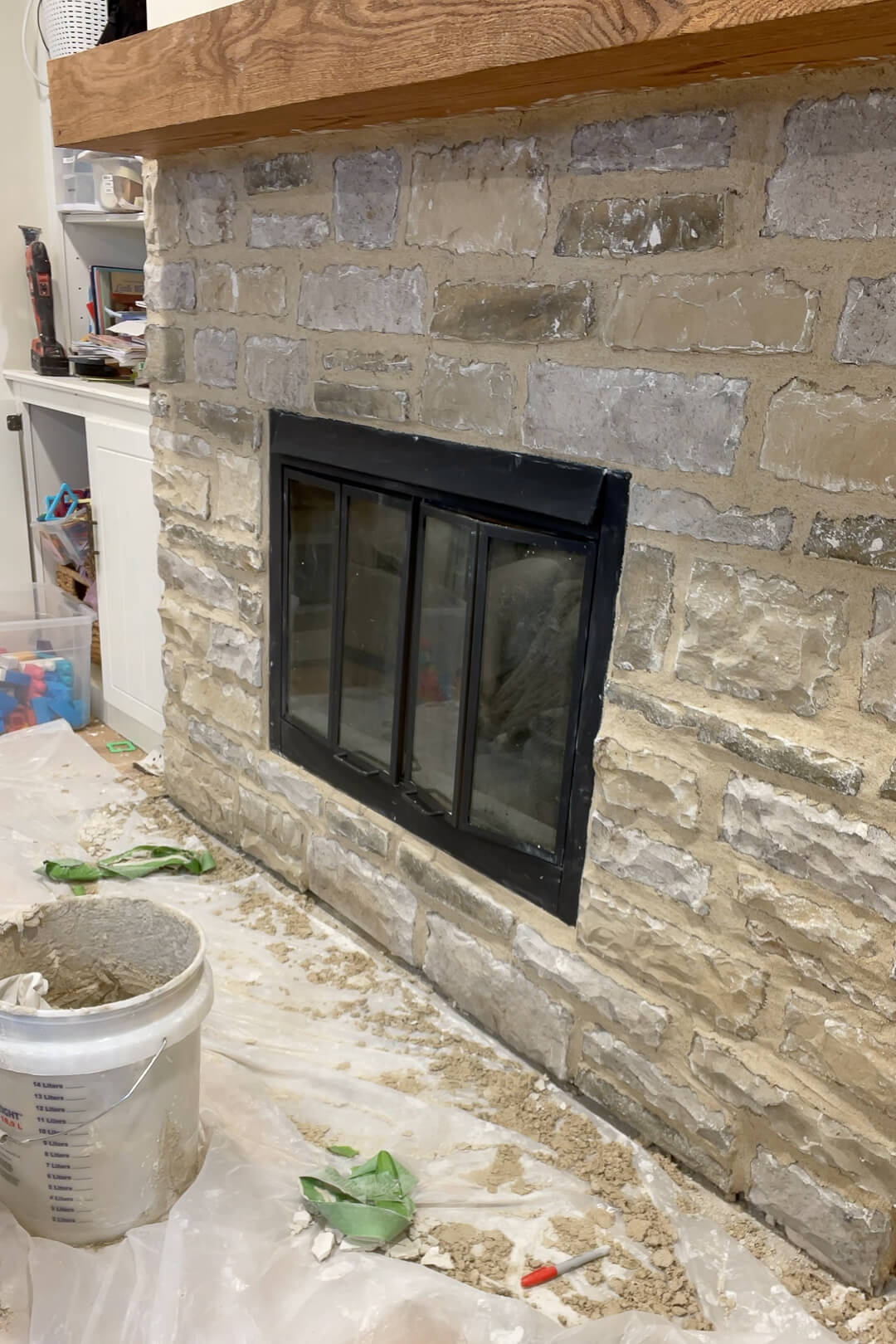 A DIY updated stone fireplace surround.