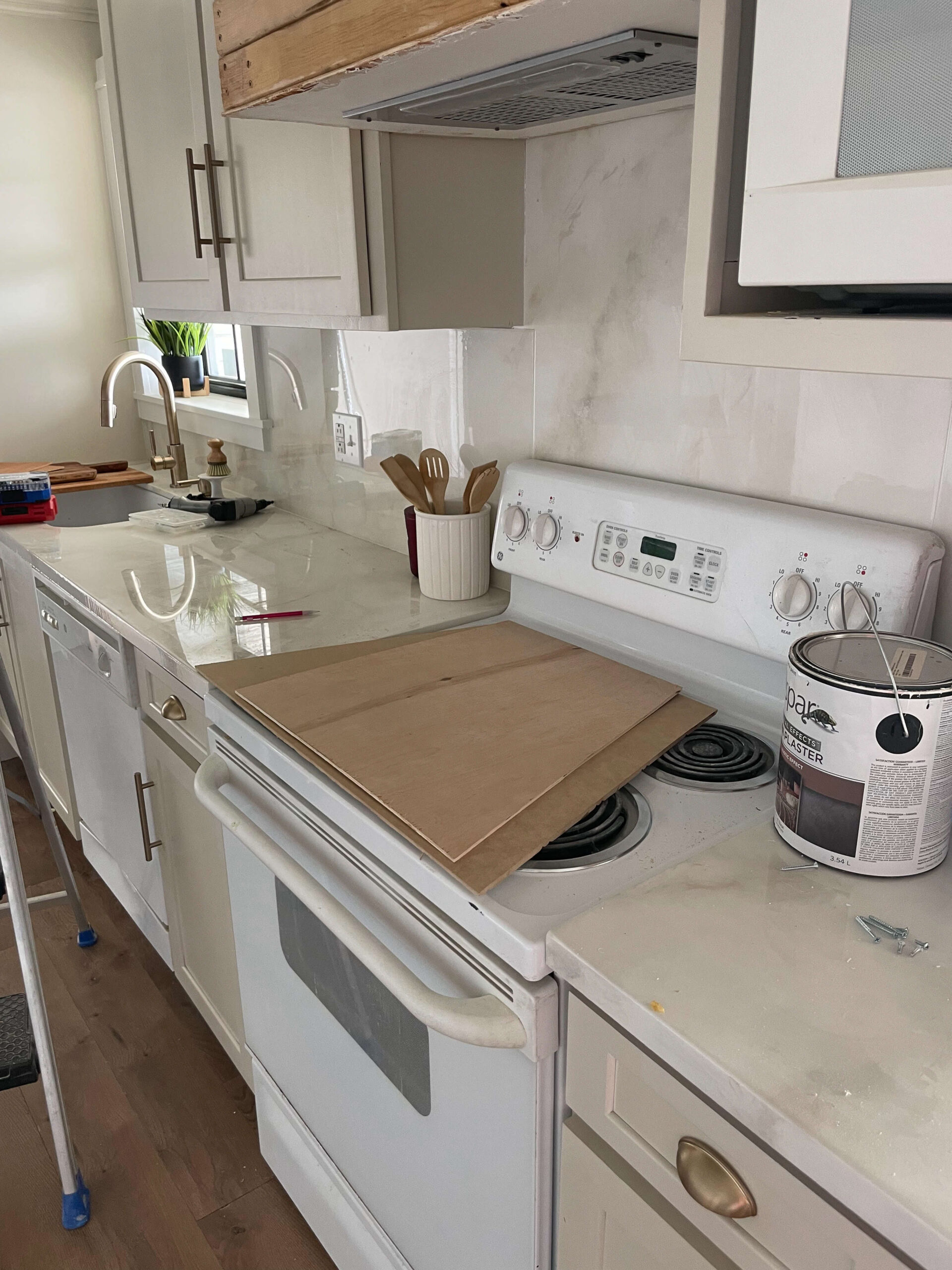 Using venetian plaster on a DIY range hood cover.