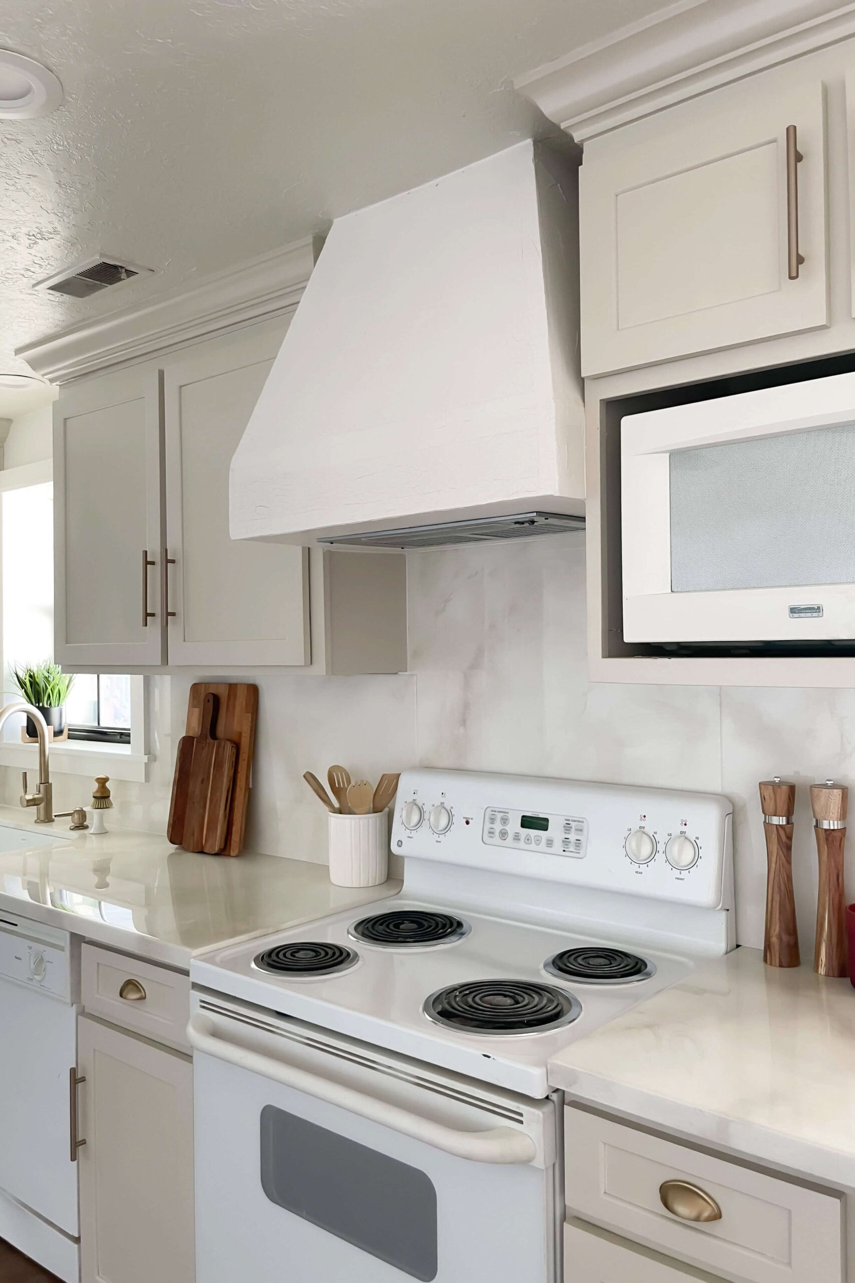 A finished picture of a DIY range hood cover that I built during a budget kitchen remodel.