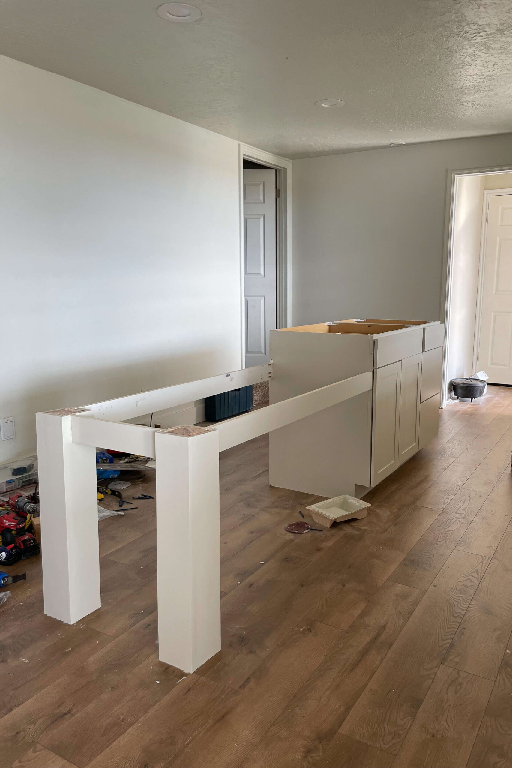 Painting a DIY kitchen island the same color as the rest of the cabinets.