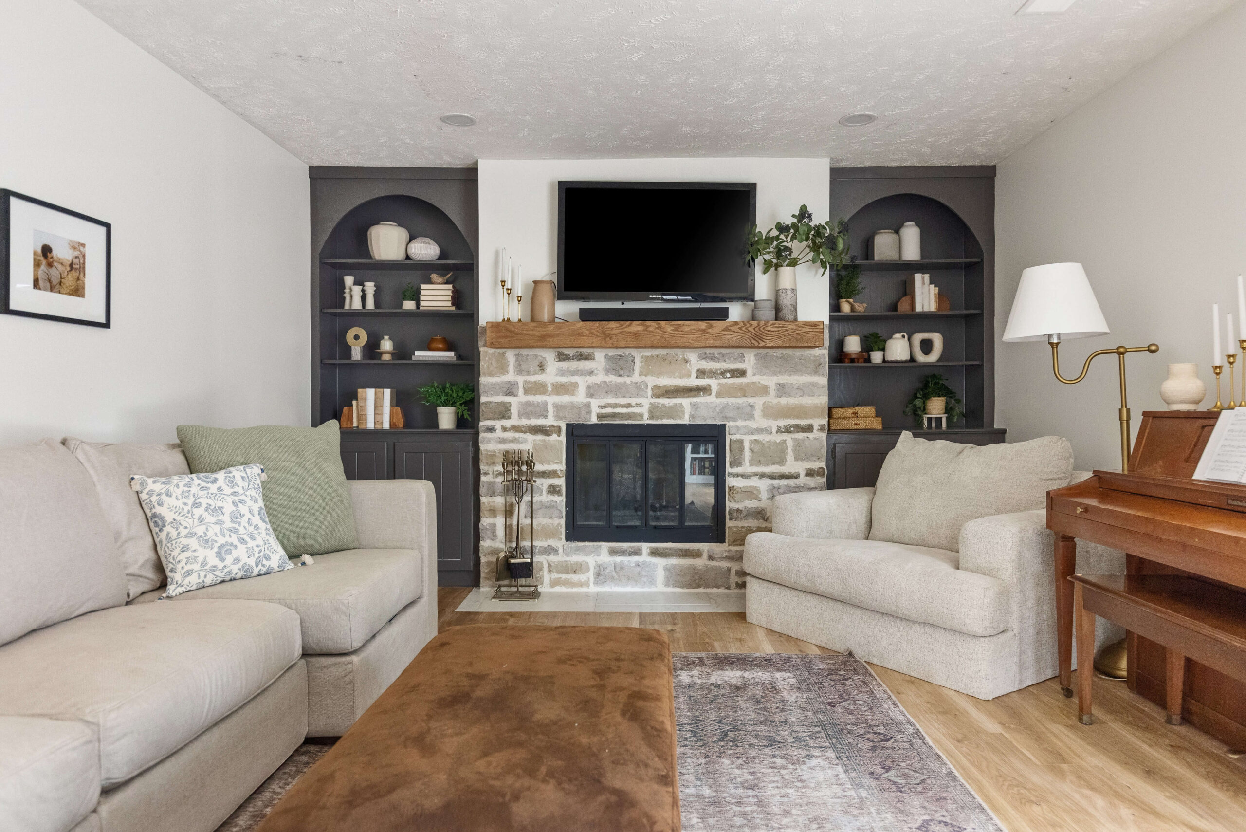 After photo of a DIY rock fireplace surround.