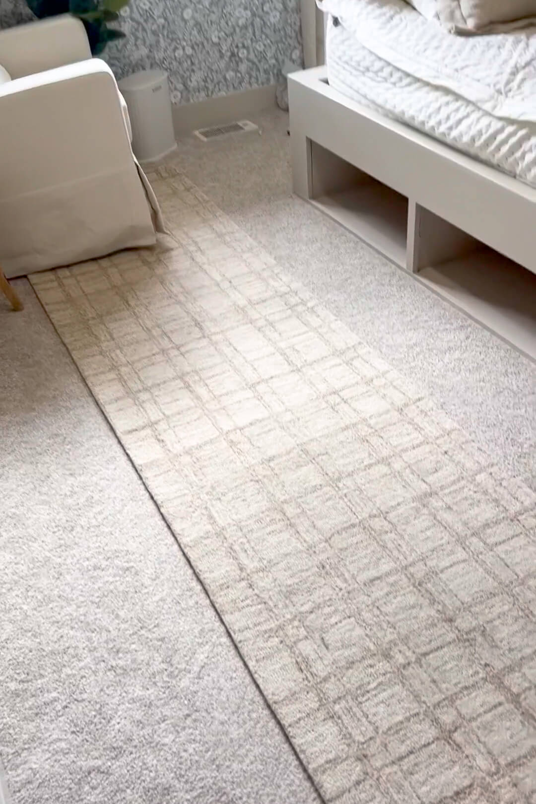 Rug on top of carpet in a kids' bedroom.