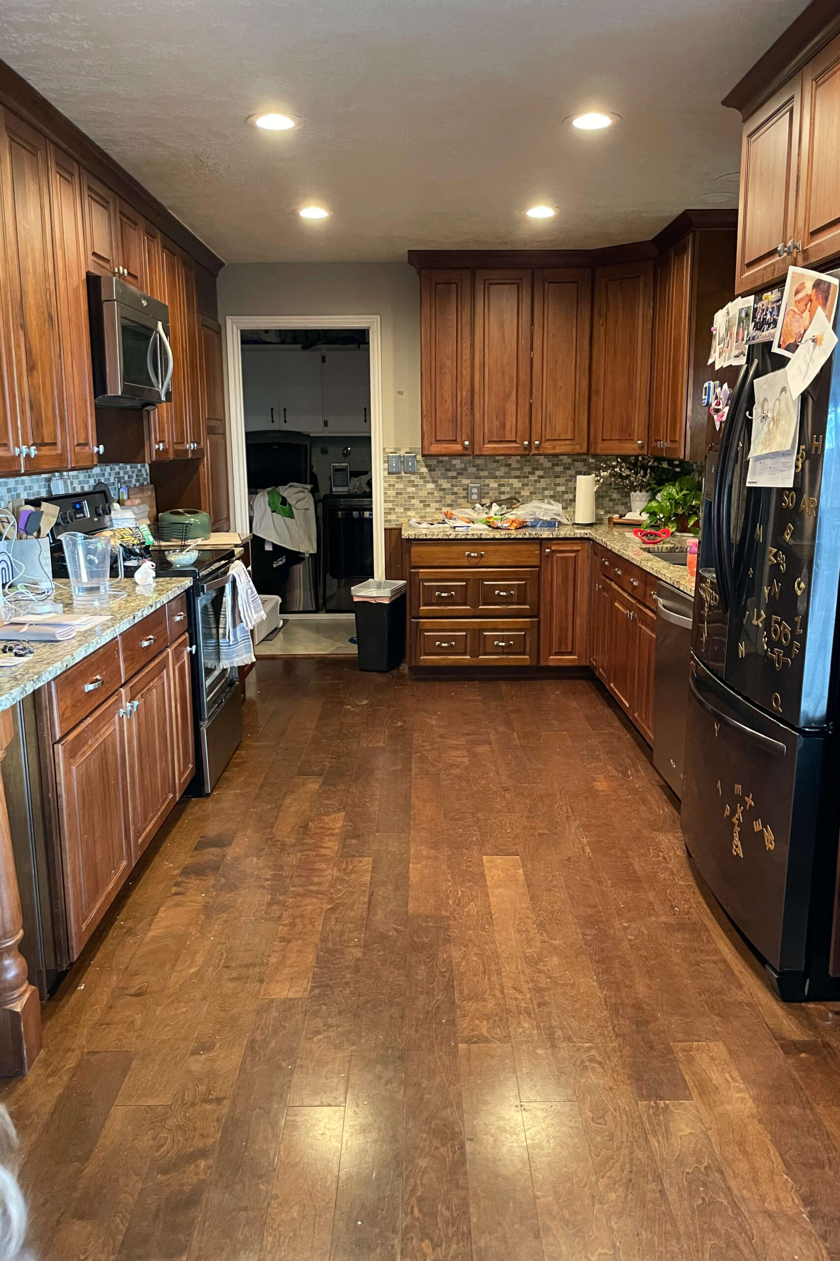 Before photo of a dated kitchen before painting with high quality cabinet paint. 