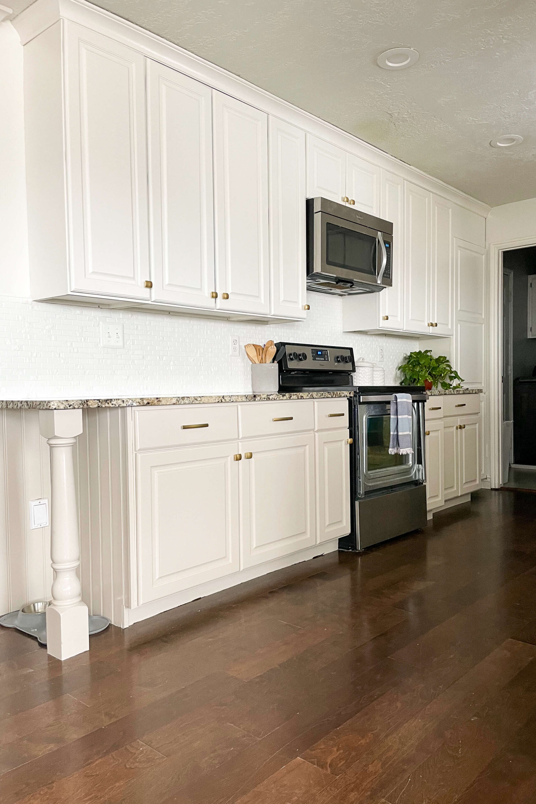 Before and after photos of kitchen cabinet painting.