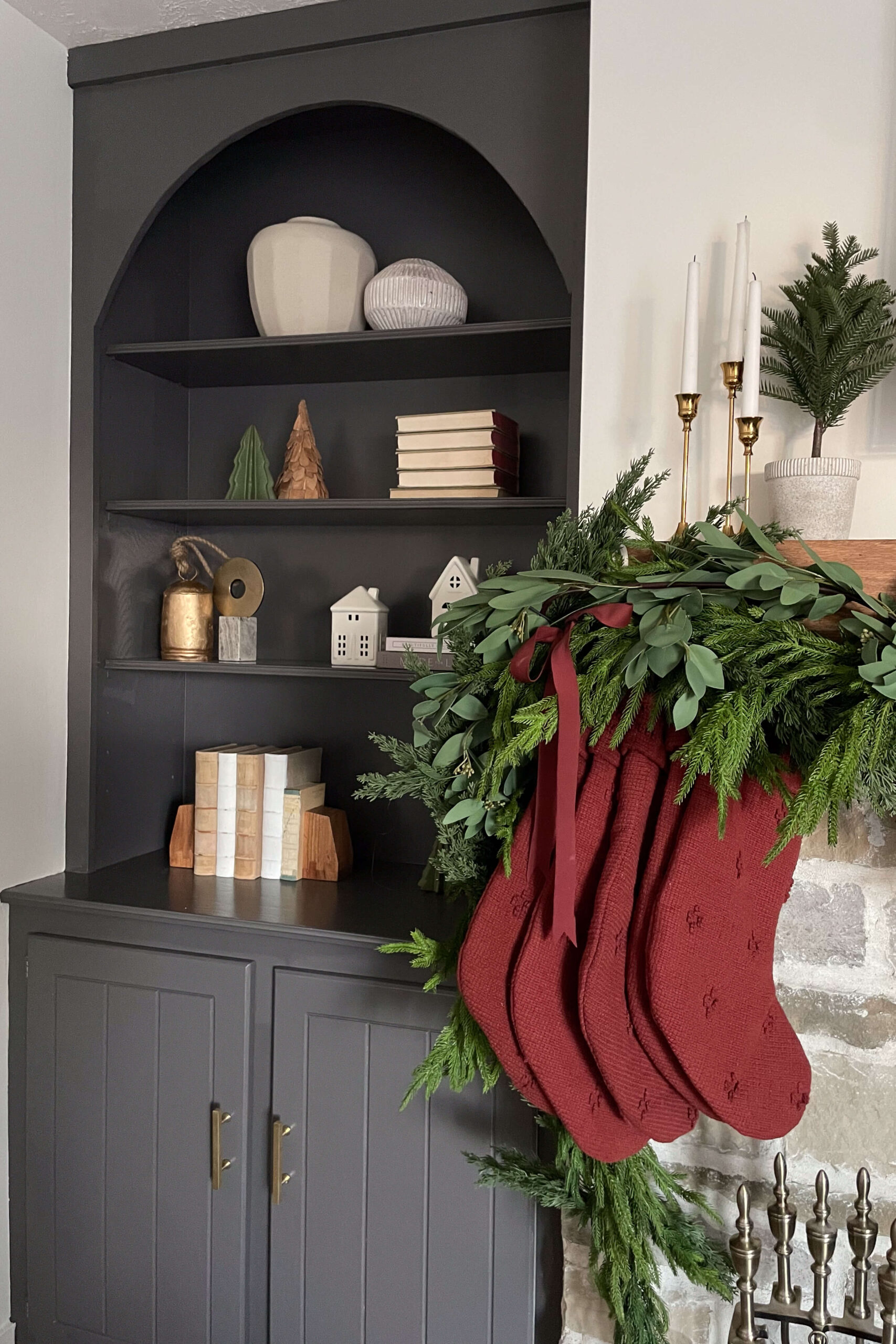 Painted, living room shelves decorated for Christmas.