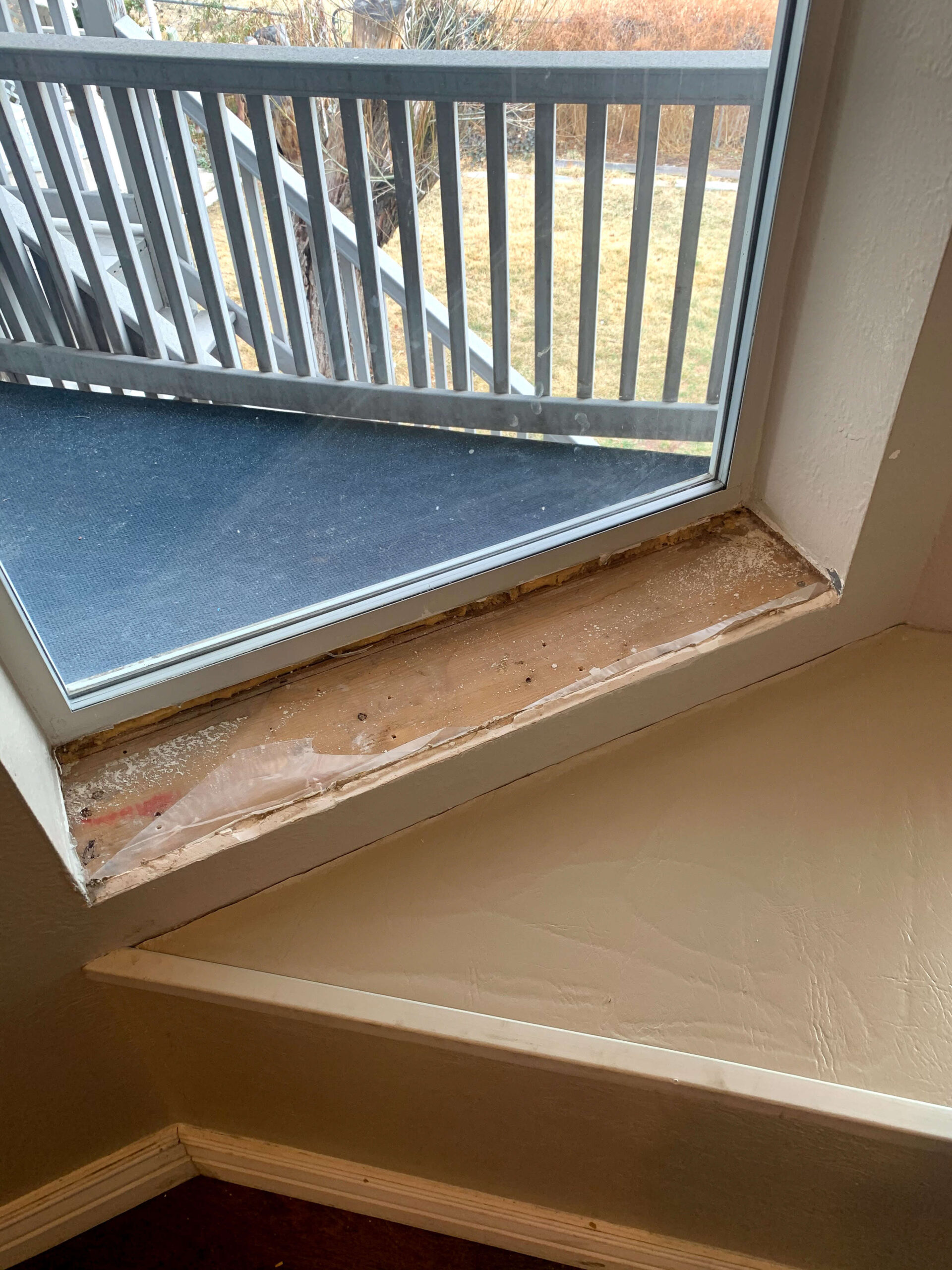 Adding a new window sill to a bay window.