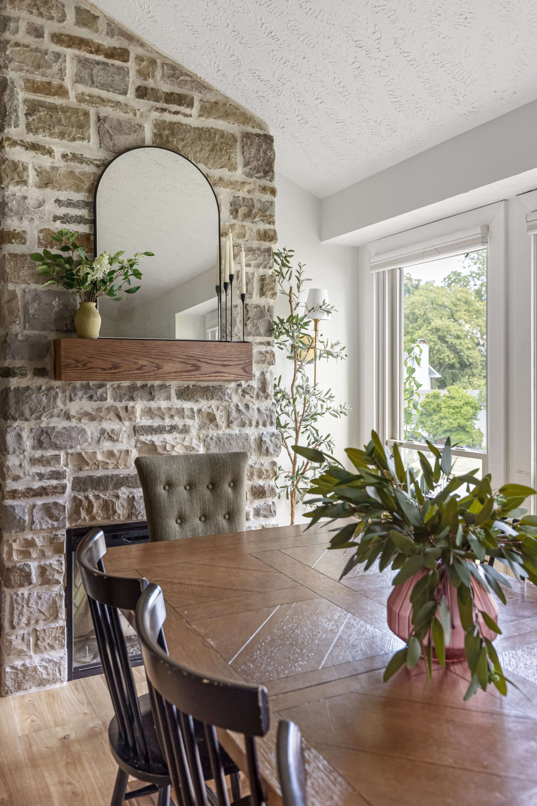 Gorgeous stone fireplace in a dining room.