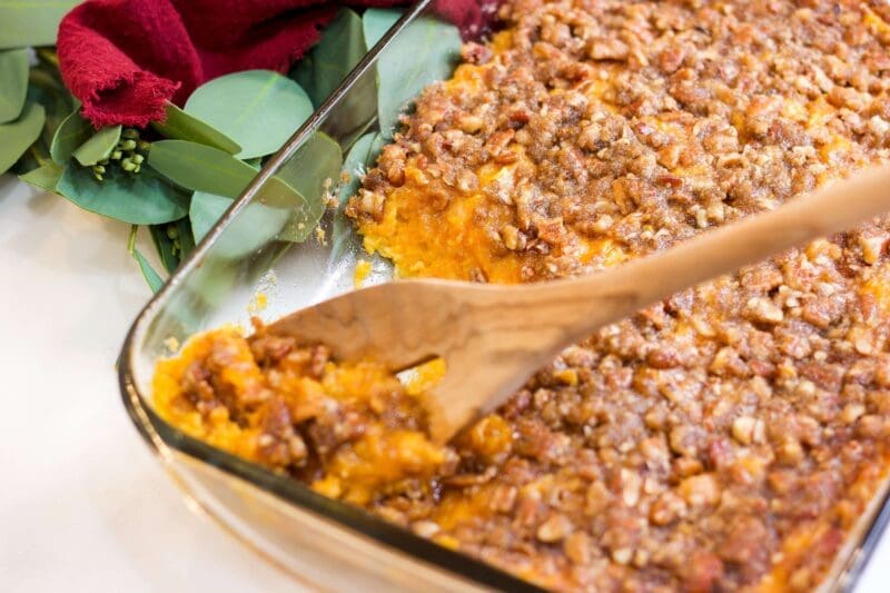Sweet potato casserole with a pecan topping for a Thanksgiving menu